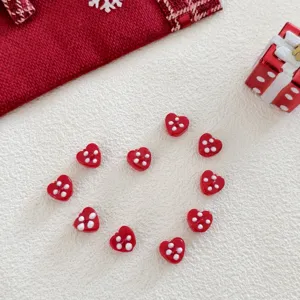 Red heart glass beads DIY handmade accessories for Christmas tree holiday decoration detail shot
