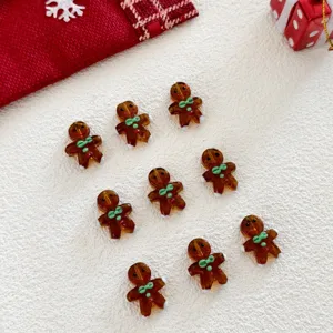 Detailed view of Christmas gingerbread glass charms, perfect for DIY holiday crafts and jewelry.