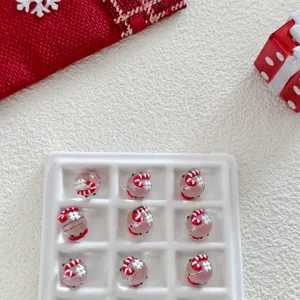 Christmas glass bead detail shot, candy cane and snowflake design, DIY craft accessory showcase
