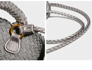 Detailopname van de handgeweven lederen handtas met gevlochten textuur en metalen ring.