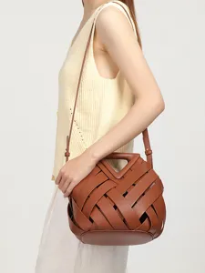 Retro brown woven leather crossbody bucket bag with chic triangular cutout handle for women.