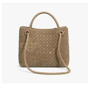 Woven leather detail of chic women handbag, versatile khaki crossbody tote bag style.
