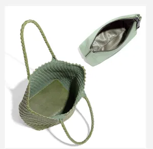 Green woven tote bag with matching pouch, stylish large capacity casual shoulder bucket handbag.