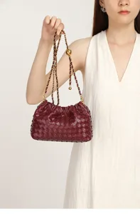 Woven leather shoulder bag for women, classic pleated cloud bag with stylish chain strap.
