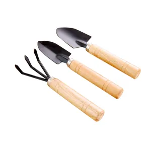Ensemble d'outils de jardinage miniature à 3 pièces avec pelles et râteau pour plantes en pot.
