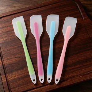 Silicone spatula detail view, colorful baking scraper and cream spreader tool for kitchen.