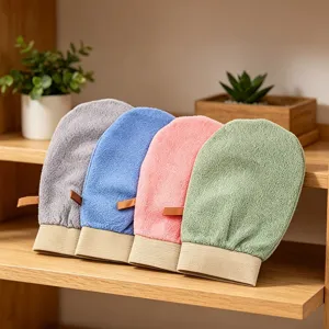 Exfoliating bath gloves in multi colors, soft textured mitts on wooden shelf detail.