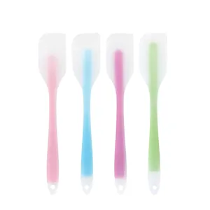 Silicone spatula detail view showing translucent design with colorful inner cores for baking.