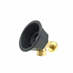 Agricultural high pressure spray gun nozzle detail view, black rubber and brass part.