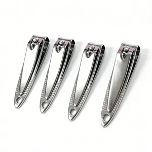 Stainless steel nail clippers detail view, featuring anti-slip texture and hanging hole design.