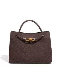 Brown suede woven tote bag with chic metal knot clasp for stylish daily commuting and chic looks.