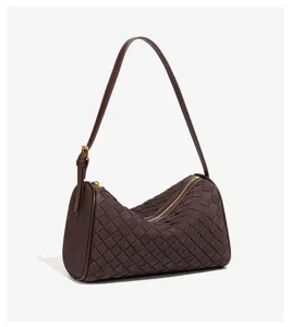 Dark brown woven shoulder bag, stylish cylindrical pillow purse with zipper closure.
