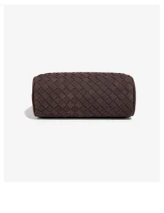 Dark brown woven leather cylinder bag detail, classic intrecciato texture design.