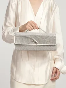 Rhinestone evening clutch bag for women, sparkling diamond handbag with top handle and lock.