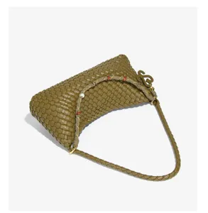 Olive green woven leather hobo shoulder bag, handcrafted dumpling purse, stylish underarm bag detail.