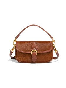 Retro Handtasche aus echtem Kuhfell Leder, braune elegante Baguette Schultertasche mit goldner Schnalle.