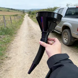 Flexible plastic fuel funnel with corrugated hose for easy automotive engine oil transfer.