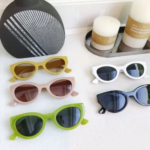 Detail shot of trendy narrow frame cat-eye sunglasses in multiple stylish colors for daily wear.