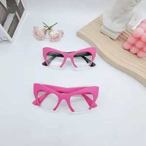 Detailed view of trendy pink cat eye blue light blocking glasses with stylish half-frame design.