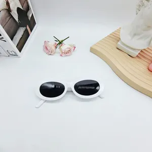 Retro white oval sunglasses for women, trendy 90s fashion UV protection eyewear detail display.