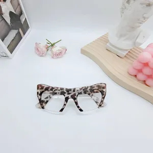 Fashion cat-eye anti-blue light glasses with trendy leopard print half-frame design for women.