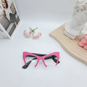 Trendy cat eye blue light blocking glasses for women, stylish half frame pink optical eyewear.