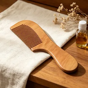 Detailed view of a portable wooden comb, natural solid wood anti-static hair care tool.