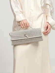 Elegant silver rhinestone evening clutch bag, luxury sparkling shoulder bag for women.