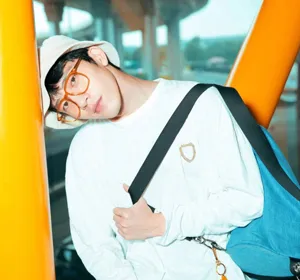 Detailed close-up view of the fashionable transparent big-frame optical glasses on model.