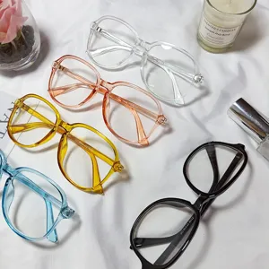 Detailed shot of trendy big frame optical glasses with clear and colorful frames.