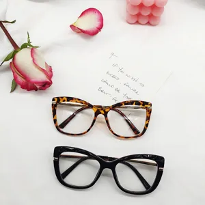 Detailed view of fashionable leopard print and black cat eye optical eyeglass frames.