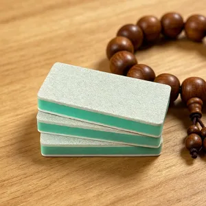 Sponge polishing block detail view, multi-layer abrasive surface for jade, amber and nail care.