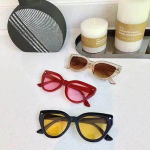Trendy cat-eye sunglasses with UV protection, stylish colored lenses for street snap outfits.