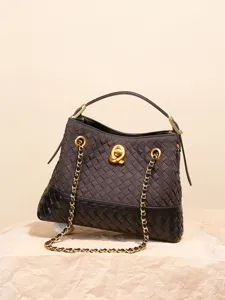 Retro woven suede tote bag for women, stylish bucket cross-body chain bag with chic clasp.