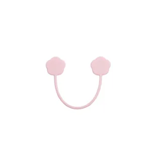 Pink silicone magnetic cable tie and cute flower earphone organizer for desktop neat storage.