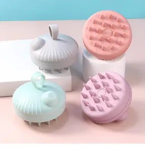 Silicone shampoo brush and scalp massager detail view showing soft bristles and press design.