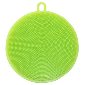 Green round silicone dishwashing brush with hanging hole for kitchen cleaning and fruit washing.