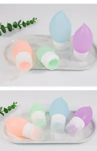 Portable silicone travel bottles set in cute teardrop shape, leakproof containers for lotion and shampoo.