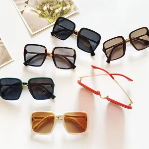 Trendy square sunglasses for women, gradient lenses with UV400 protection and chic metal frame.