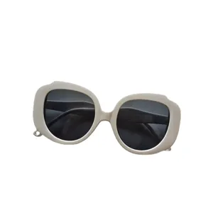 Oversized round sunglasses for women, trendy chunky frame eyewear with UV protection lenses.