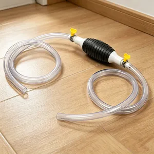 Detailed view of manual fuel siphon pump showing clear plastic hose and black rubber squeeze bulb.