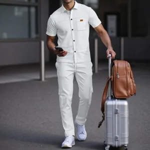 Detailed view of men's casual waffle knit short sleeve shirt and cargo pants set outdoors.