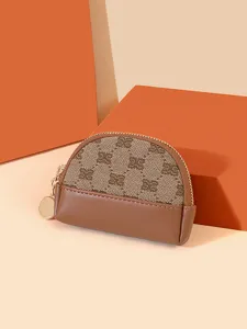 Vintage mini coin purse with zipper, cute compact half-moon design for women and girls.