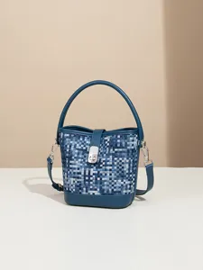Stylish blue woven bucket bag with top handle and shoulder strap for women daily use.