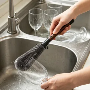 Detail view of the long handle 2-in-1 bottle cleaning brush in use, practical cup cleaner.