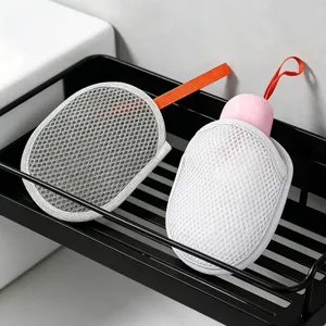 Detail view of foaming soap net mesh bags for face cleansing, featuring convenient hanging straps.