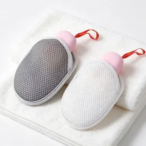 Dual-color foaming soap net with soft mesh and handy hanging loop for deep facial cleansing.