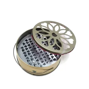 Stainless steel mosquito coil box detail showing patterned lid and interior spiked tray.