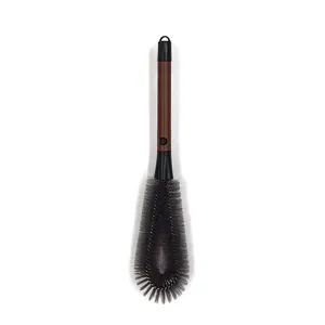 Detailed view of the long handle bottle cleaning brush with grey dense bristles and hanging loop.