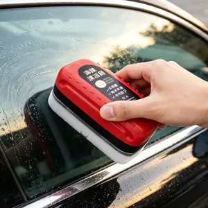 Car windshield oil film cleaning brush detail view for clear automotive glass care.
